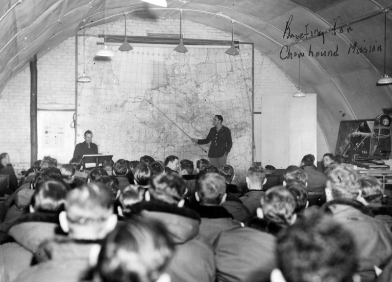 Crews of the 493rd are briefed prior to a Chowhound Mission