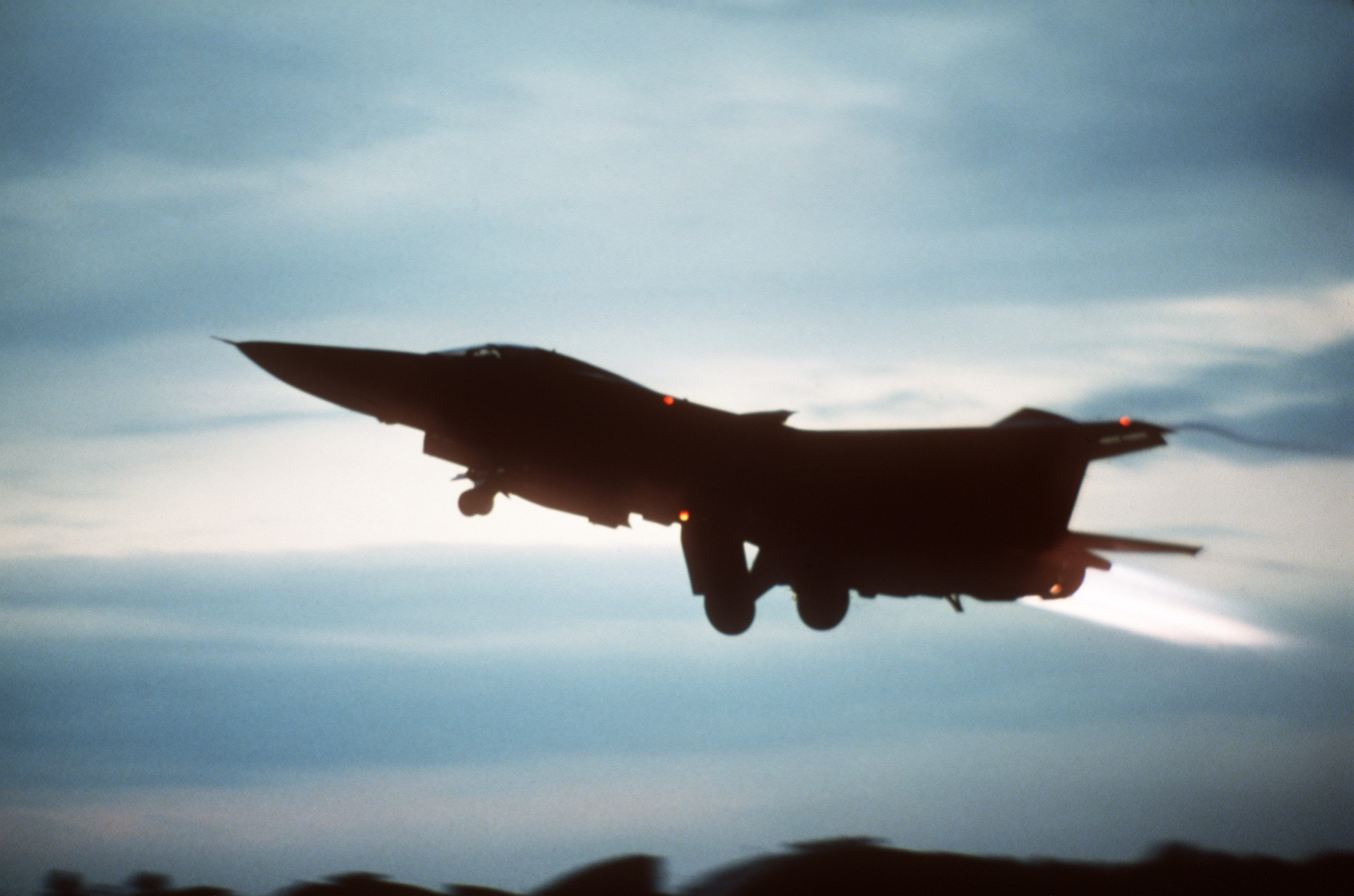 An F-111 taking part in El Dorado Canyon takes off from Lakenheath on the evening of 14th April 1986