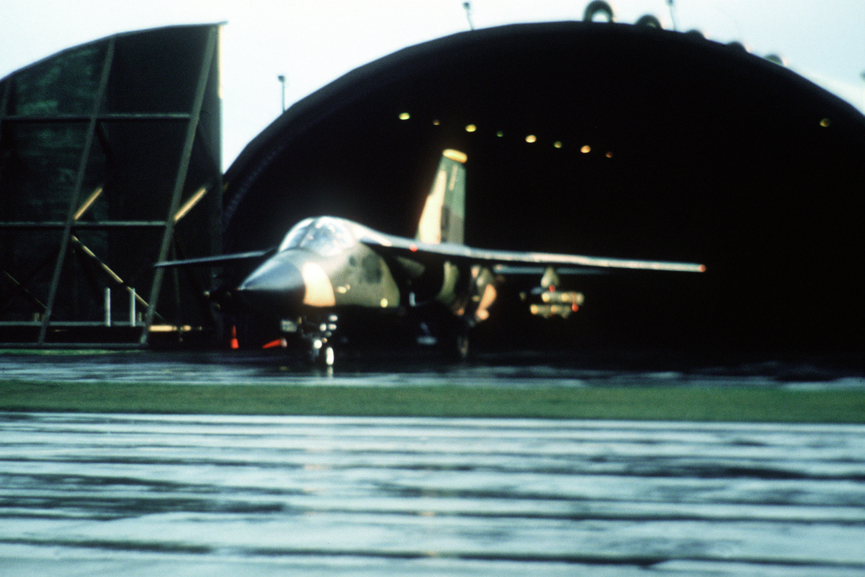 An F-111 of the 48th Fighter Wing exits a hardened aircraft shelter at Lakenheath to take part in the Libyan Raid