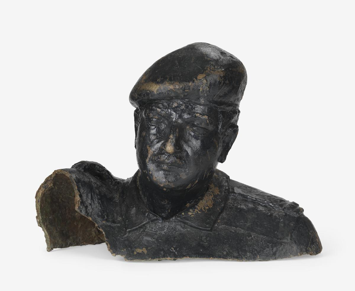 Broken bronze bust of Saddam Hussein, recovered from in Iraq in 2004