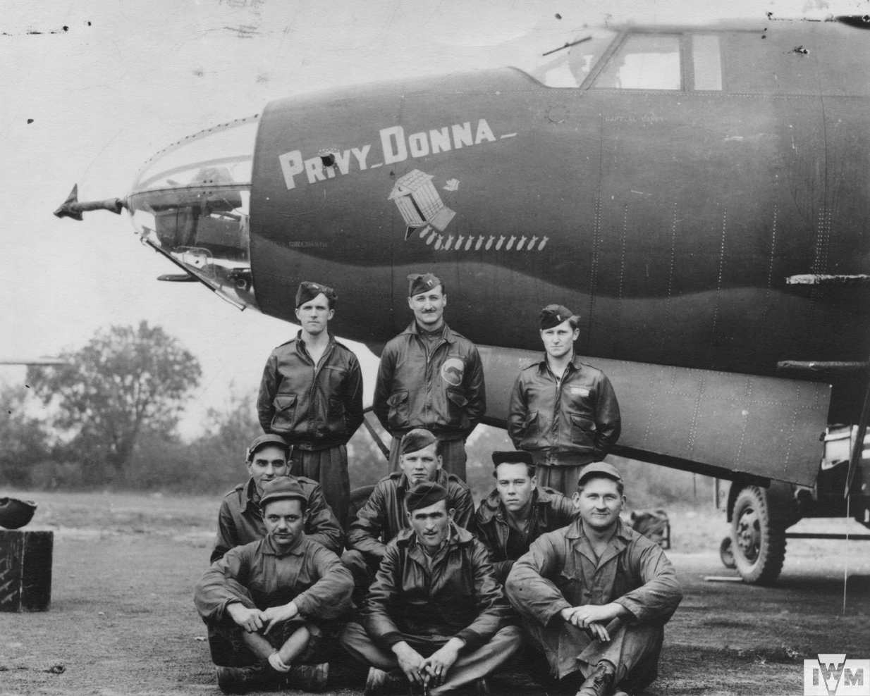 A bomber crew of the 386th Bomb Group with their B-26 Marauder (RU-A, serial number 41-31658) nicknamed "Privy Donna". c. 1943