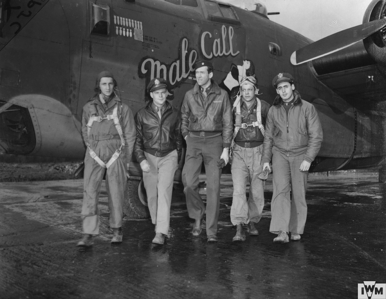 Jimmy Stewart Operations Officer of the 453rd Bomb Group, with a bomber crew after a mission, April 1944.