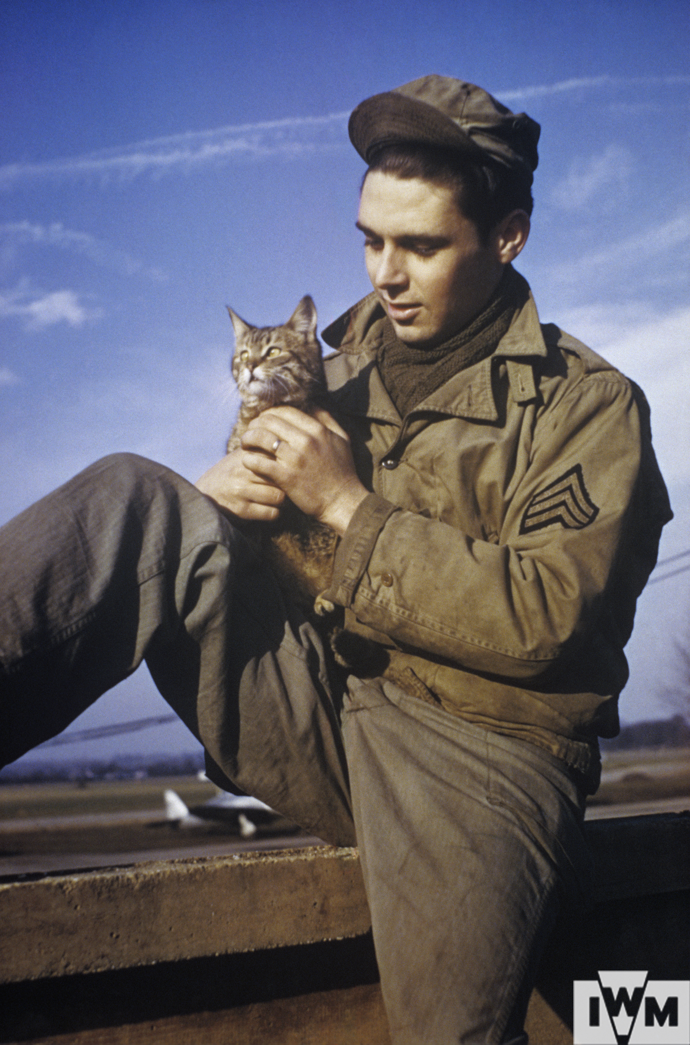 William D "Bill" Pulliam a photographic officer of the 91st Bomb Group with "Cross Eyes" a cat mascot at Bassingbourn