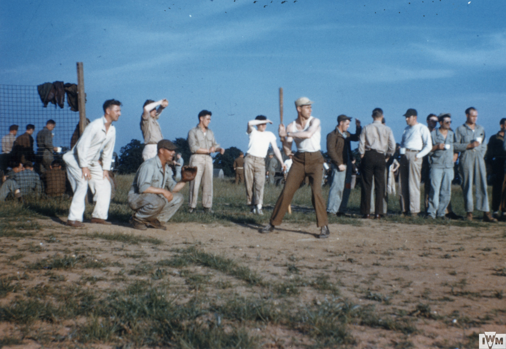 55th Fighter Group crewmen relax with a game of baseball