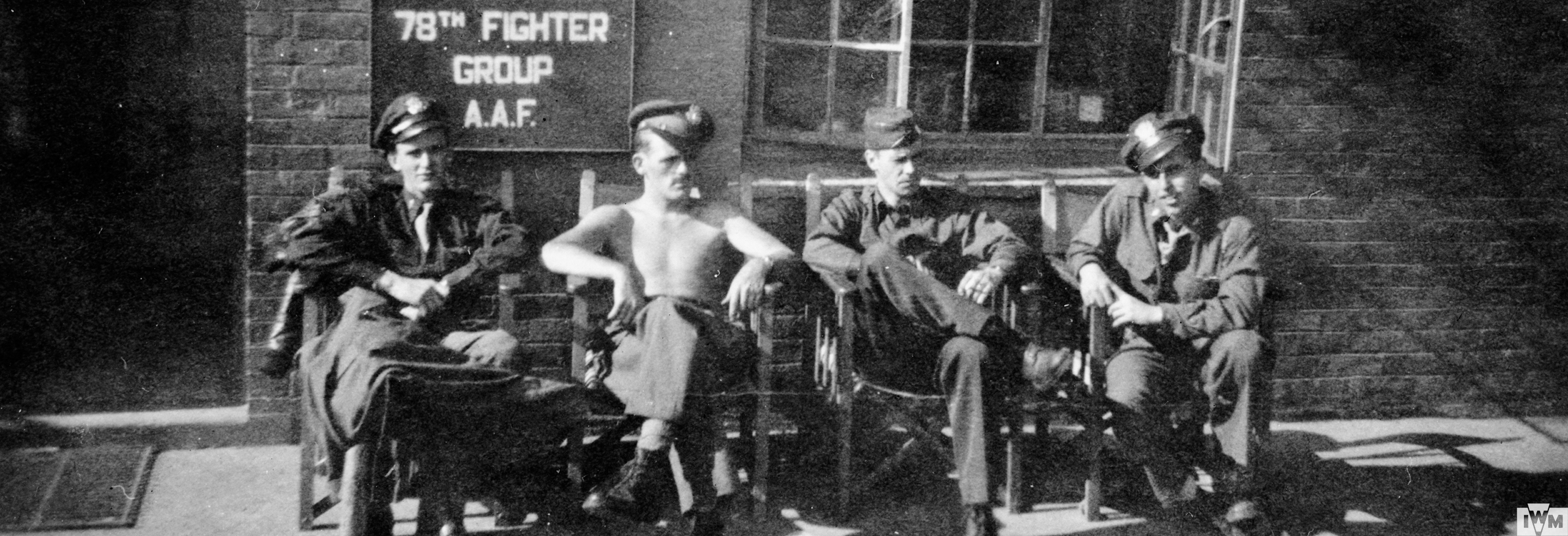 82nd Fighter Squadron pilots relaxing outside the Squadron 'ready room':