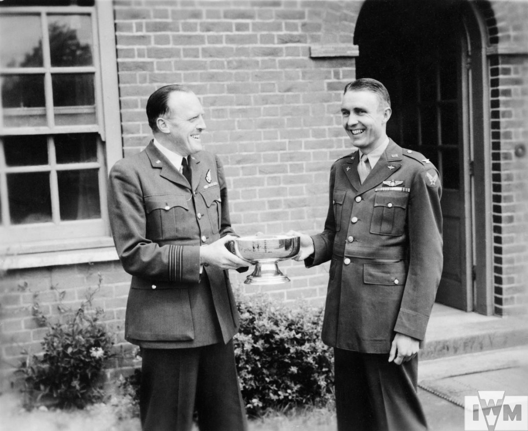 Duxford's handover ceremony: RAF Wing Commander S L Matthews hands control of Duxford to Colonel Arman Peterson, USAAF