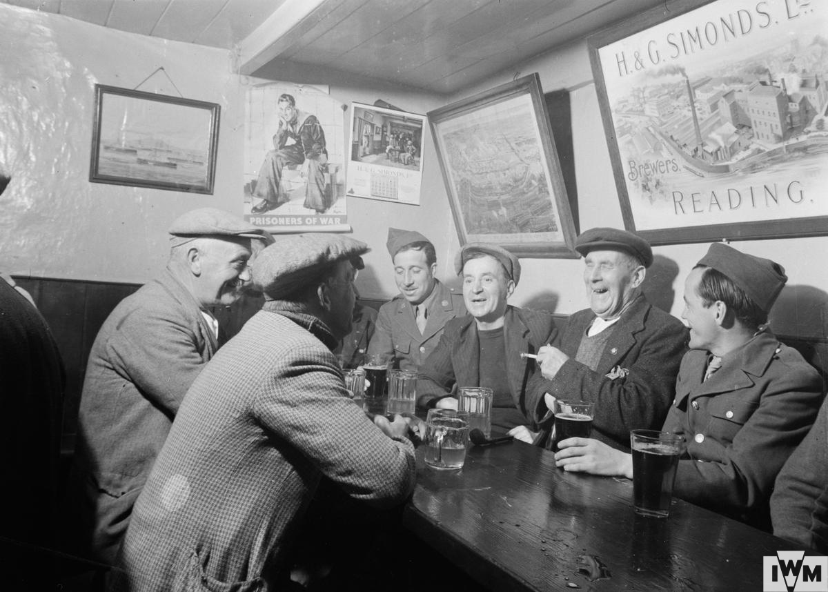 Locals and United States troops meet at the Dove Inn, Burton Bradstock, Dorset, 1944.
