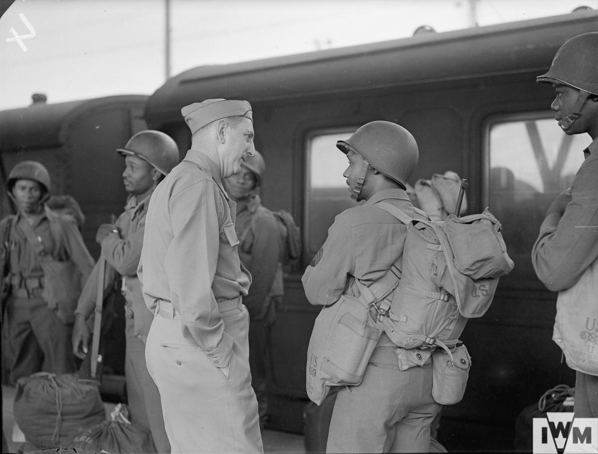 Senator Russell, of Georgia, talking to a Black American soldier from Georgia.