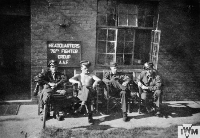 82nd Fighter Squadron pilots relaxing outside the Squadron 'ready room':