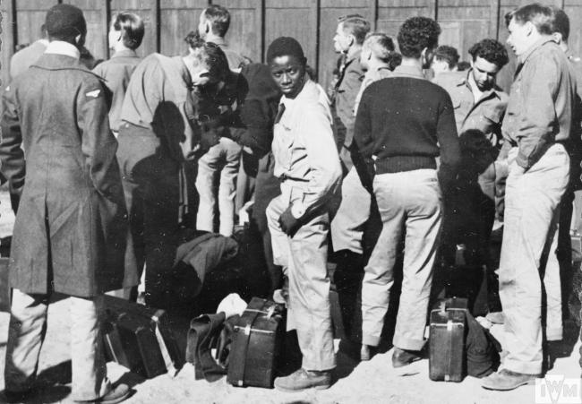 Newly arrived American prisoners of war with their luggage at Stalag Luft III, Sagan, amongst them Alexander Jefferson a Black airman of the 332nd Fighter Group.